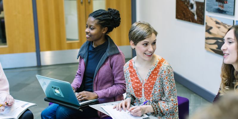 Students in the School of Earth and Environment foyer