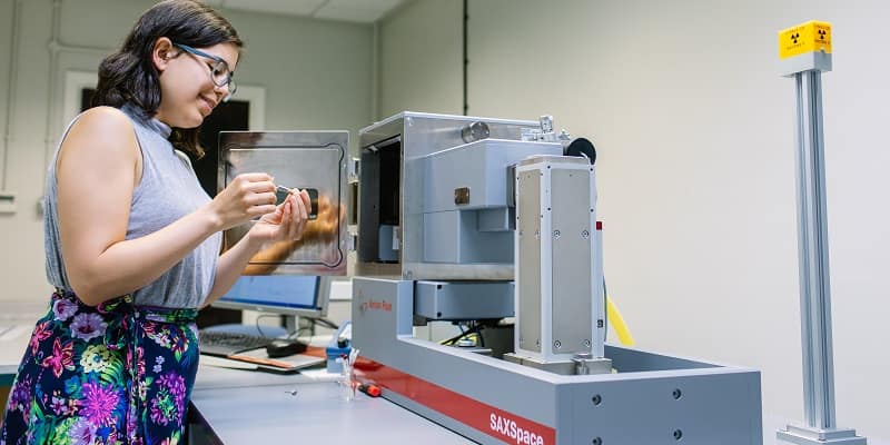 Researcher using analytical machine