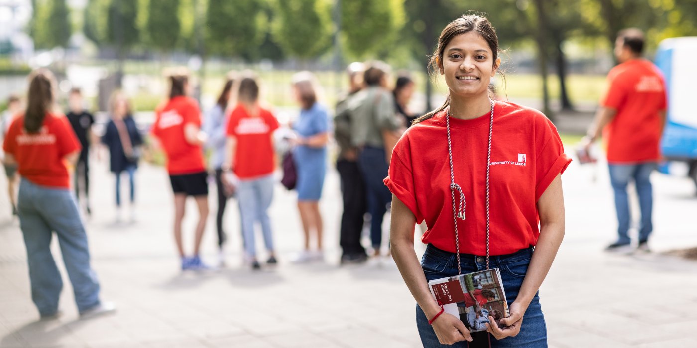 Open Day event banner student in red shirt