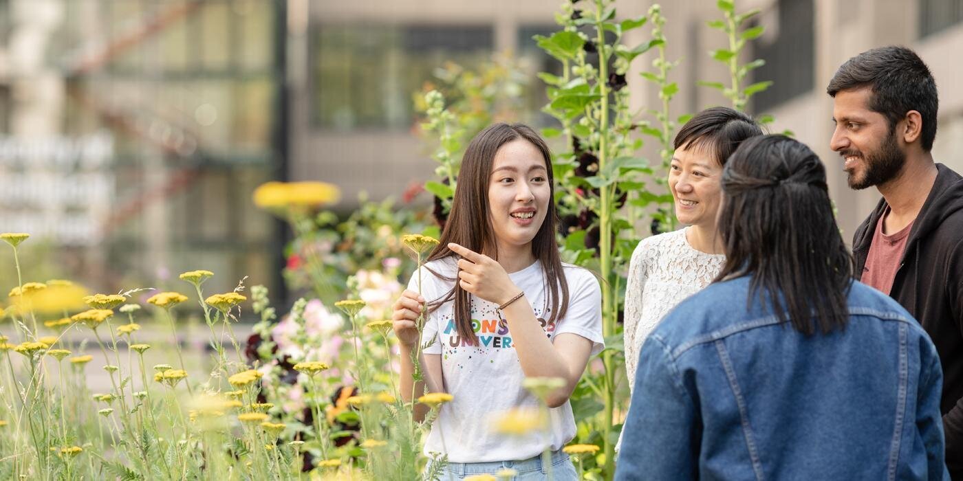 Earth and Environment students talking in the sustainable garden at the University of Leeds.