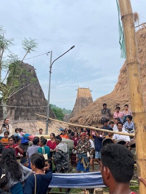 A solar powered light in the central part of a traditional Sumba village brings modern technology to provide light for cultural ceremonies that will go on after night fall