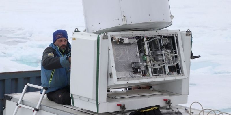 Professor Brooks operating a cloud radar machine.