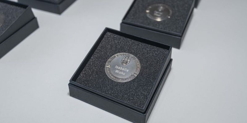 Image of Isabelle Wicks Beaumont award, an engraved award coin.