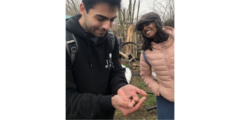 Sustainable Food Systems MSc student, Husain Alogaily, holding a bee