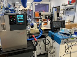 Image of lab. Various machines and technical instruments with graphs and wires attached.