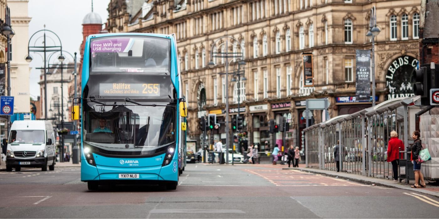 Image of a blue public bus in Leeds
