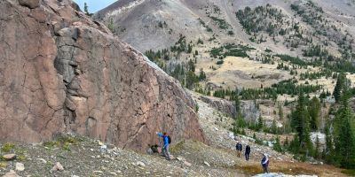 Members of the research team examining a large dike—a sheet of magma that transported magma towards Earth’s surface, in this case millions of years ago during the Columbia River Basalt eruptions.