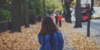 An image of a child walking home from school.