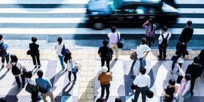 Image of pedestrians waiting to cross the road