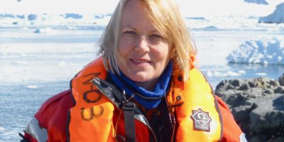Professor Dame Jane Francis wearing a life jacket in Rothera, Antarctica