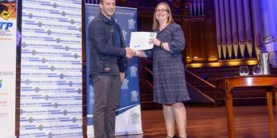 Tyron accepting the Best Young Scientist Award from ICTTP Young Scientist Committee chair, Dr Lyndel Bates.