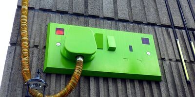 A bright green plug switch.