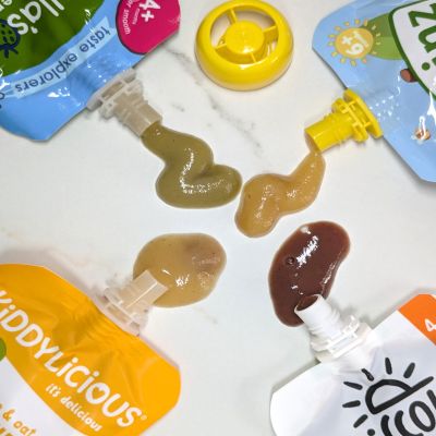 photo of four soft packs of food sauces