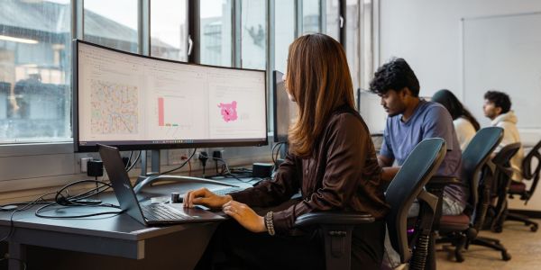 Image of people working in the computer cluster for data science and geography 2023