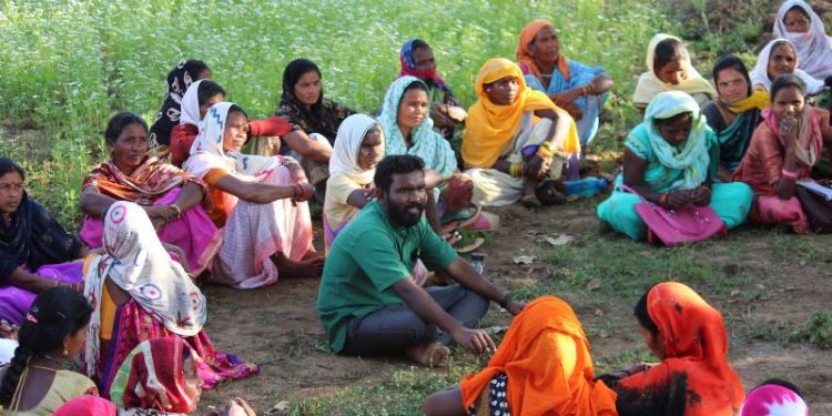 Image of Vaibhav Sonone speaking to the women of the village where he works.