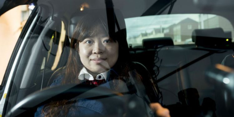 A student sits behind the wheel of our driving simulator at the Institute for Transport Studies in Leeds