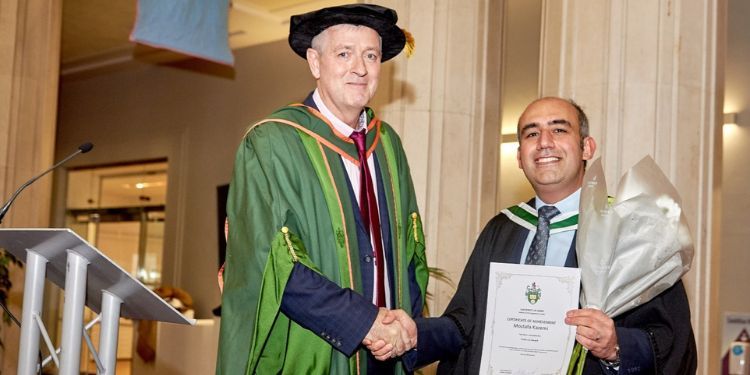 Image of ITS Masters graduate Mostafa Kazemi receiving the Frank Lai