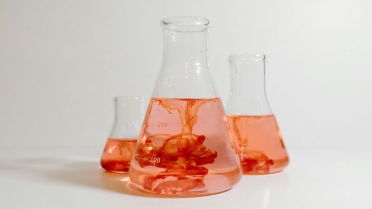 picture of  three glass beakeakers filled with liquid