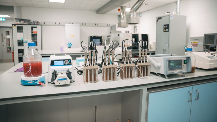 photo of a lab bench with many machines