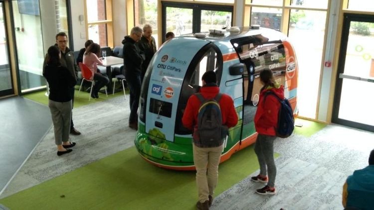 Students and staff at the Institute for Transport Studies at University of Leeds get an up-close look at the driverless POD