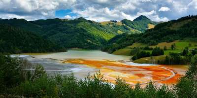 A red, polluted lake in Geamana , Romania.