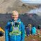 Laura Wainman looking happy in front of the 2022 Iceland eruption.