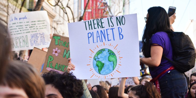 A person holding a sign at a protest that says 'There is no planet B'
Picture via Unsplash/Li-An Lim